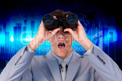 Composite image of suprised businessman looking through binocula