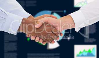 Composite image of close-up shot of a handshake in office