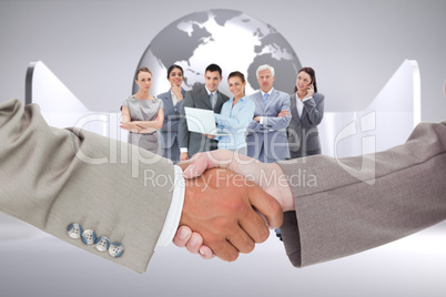 Composite image of side view of shaking hands