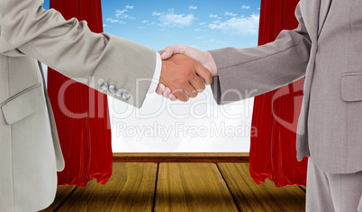 Composite image of side view of shaking hands