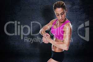 Composite image of female bodybuilder flexing in pink sports bra