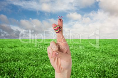 Composite image of fingers as easter bunny