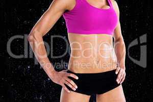 Composite image of female bodybuilder posing with hands on hips