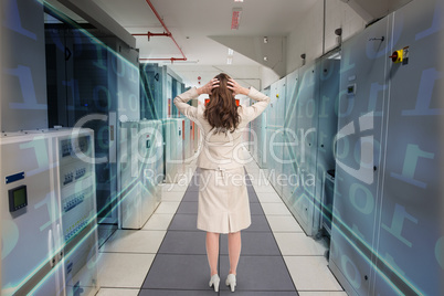Composite image of businesswoman with hands on head standing bac