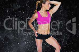 Composite image of female bodybuilder posing in pink sports bra
