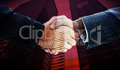 Composite image of business people shaking hands