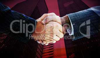 Composite image of business people shaking hands