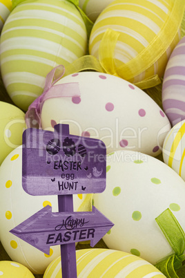 Composite image of easter egg hunt sign