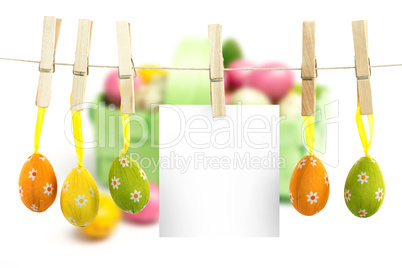 Composite image of hanging easter eggs