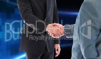 Composite image of business people shaking hands