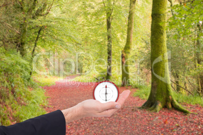 Composite image of close up of businessman with hand open