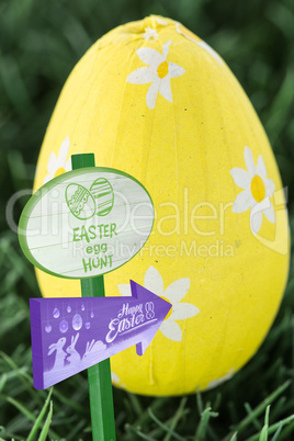 Composite image of easter egg hunt sign