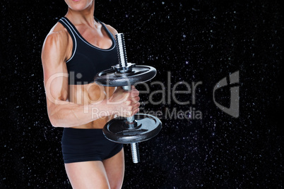 Composite image of female strong bodybuilder holding large black