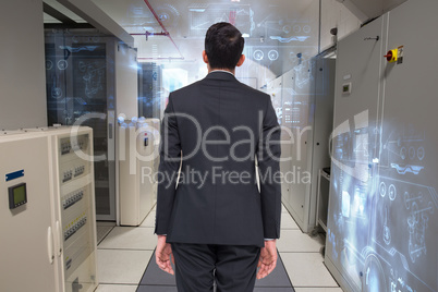 Composite image of businessman turning his back to camera