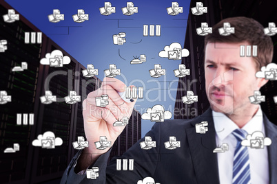 Composite image of serious businessman writing with marker