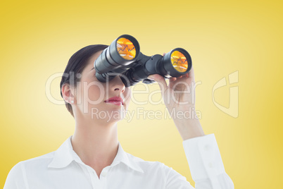 Composite image of business woman  looking through binoculars