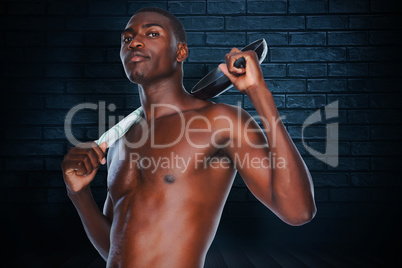 Composite image of portrait of a fit shirtless man holding fryin