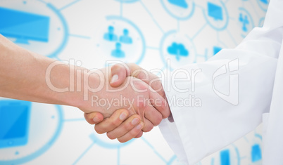 Composite image of closeup of a doctor and patient shaking hands