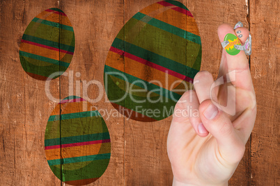 Composite image of fingers as easter bunny