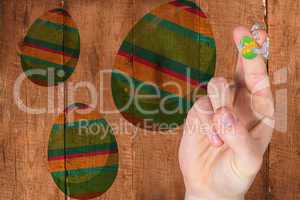 Composite image of fingers as easter bunny