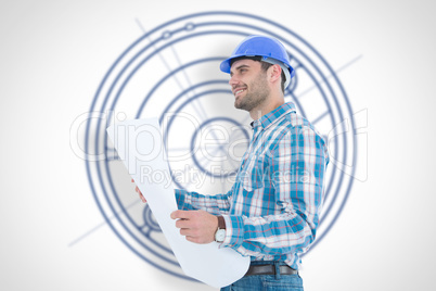 Composite image of smiling engineer looking away while holding b