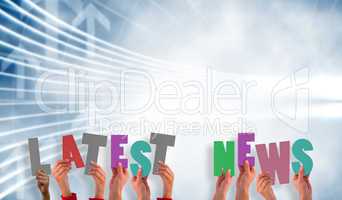 Composite image of hands holding up latest news