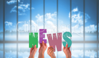 Composite image of hands holding up news