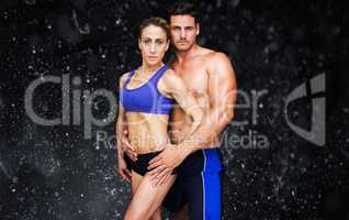 Composite image of bodybuilding couple