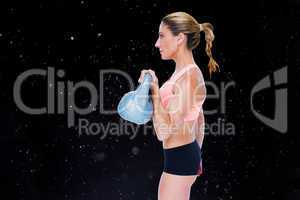 Composite image of female blonde crossfitter lifting kettlebell