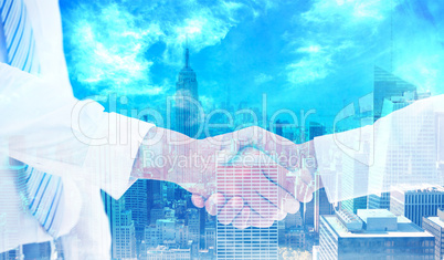 Composite image of close-up shot of a handshake in office