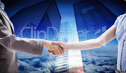 Composite image of handshake between two women