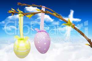 Composite image of hanging easter eggs