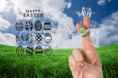 Composite image of fingers as easter bunny