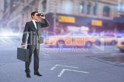 Composite image of businessman looking through binoculars