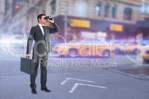 Composite image of businessman looking through binoculars