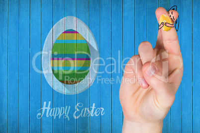 Composite image of fingers as easter bunny