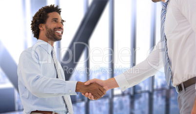 Composite image of two businessmen shaking hands in office