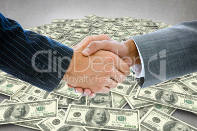 Composite image of business people shaking hands