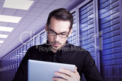 Composite image of cheerful businessman in glasses using tablet