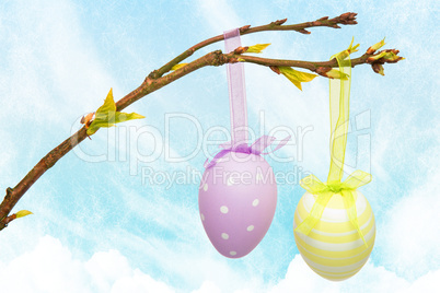 Composite image of hanging easter eggs