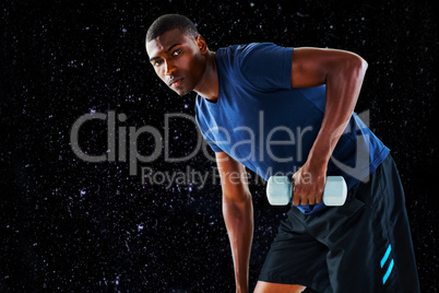 Composite image of portrait of casual young man lifting dumbbell