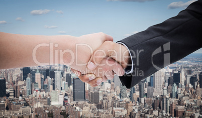 Composite image of close up of a handshake