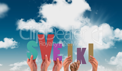Composite image of hands holding up sveiki