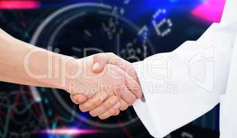 Composite image of closeup of a doctor and patient shaking hands