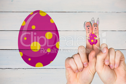 Composite image of fingers as easter bunny