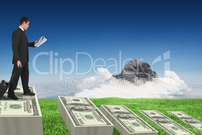 Composite image of businessman pulling his suitcase holding news