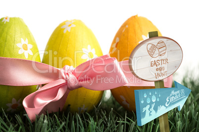 Composite image of easter egg hunt sign