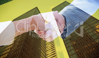 Composite image of closeup of shaking hands after business meeti