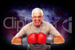 Composite image of close-up portrait of a determined senior boxe