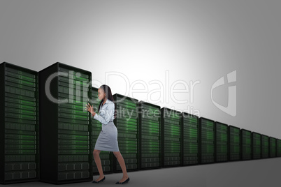 Composite image of portrait of a young businesswoman pushing a p